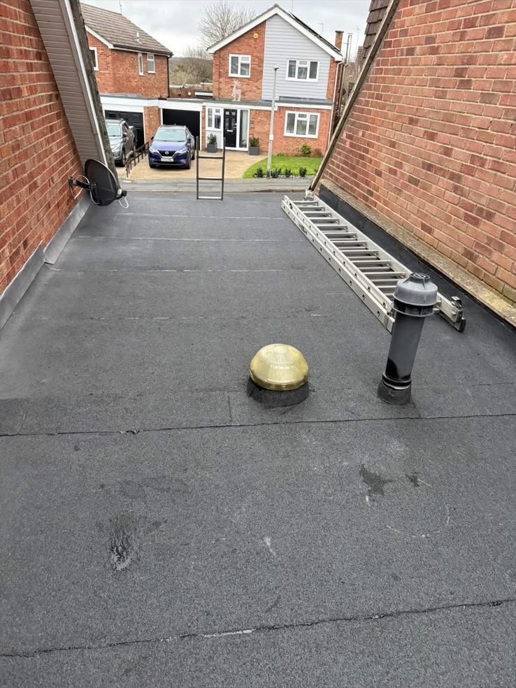Completed felt flat roof replacement with roof vent and outlet