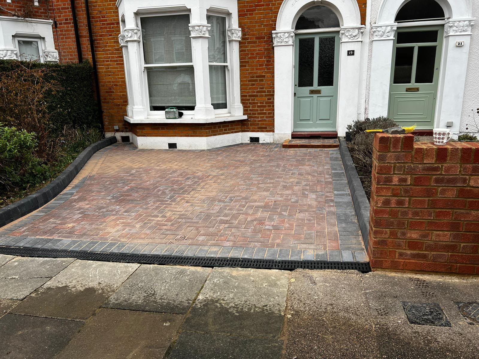 Red block paving driveway with charcoal border and new brick wall outside a Victorian terrace in Bromley